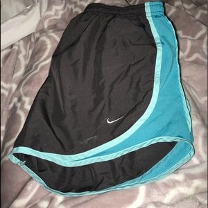 black with blue nike shorts
